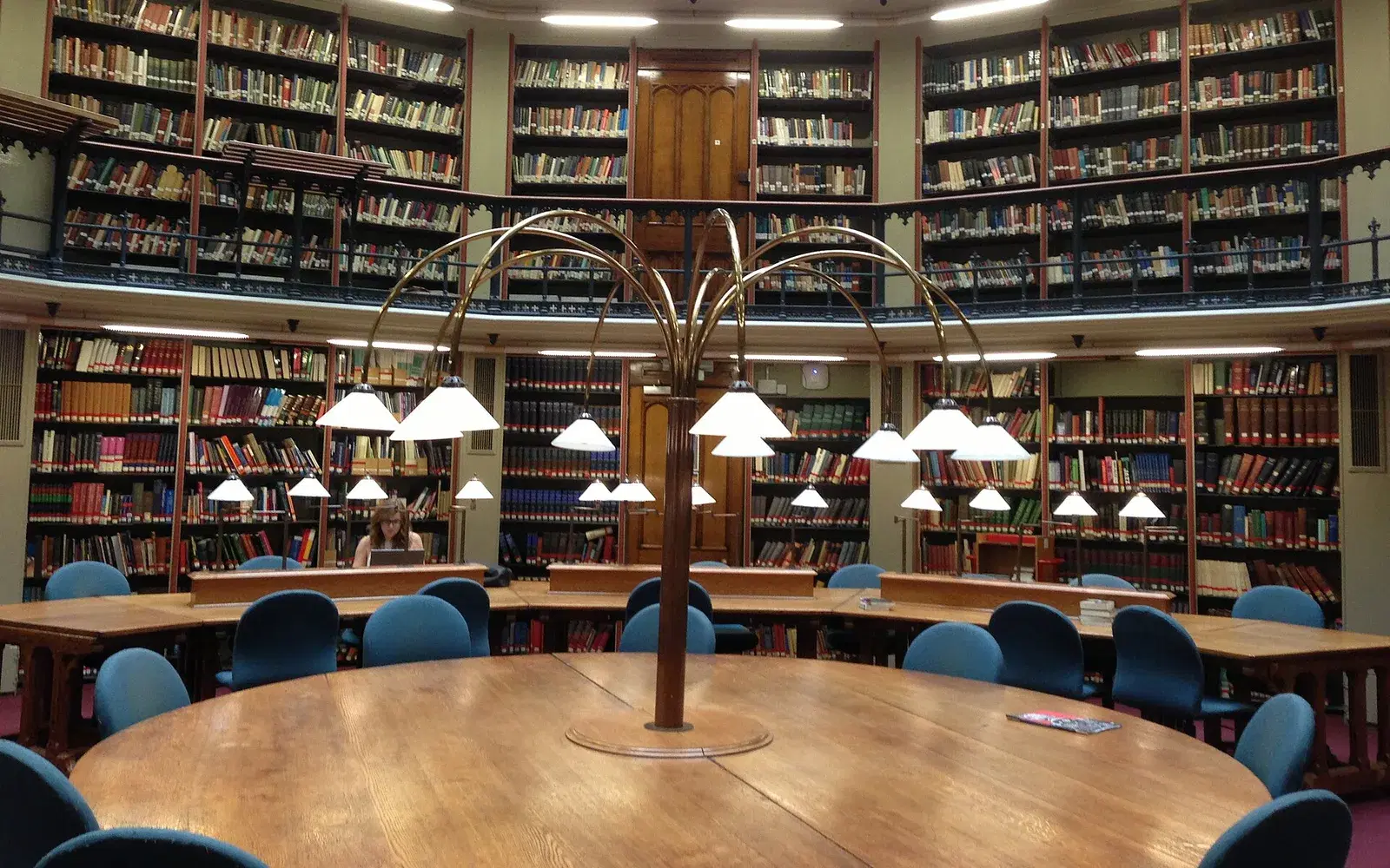 Students working at the round reading table beneath the domed ceiling of the Maughan Library